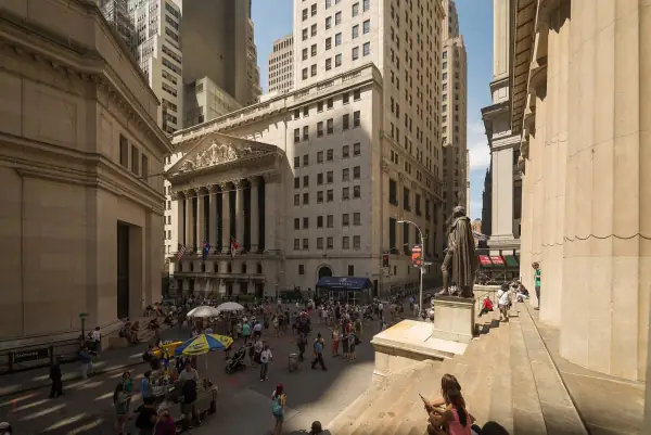 New York Stock Exchange facade at Broad and Wall Street with flag
