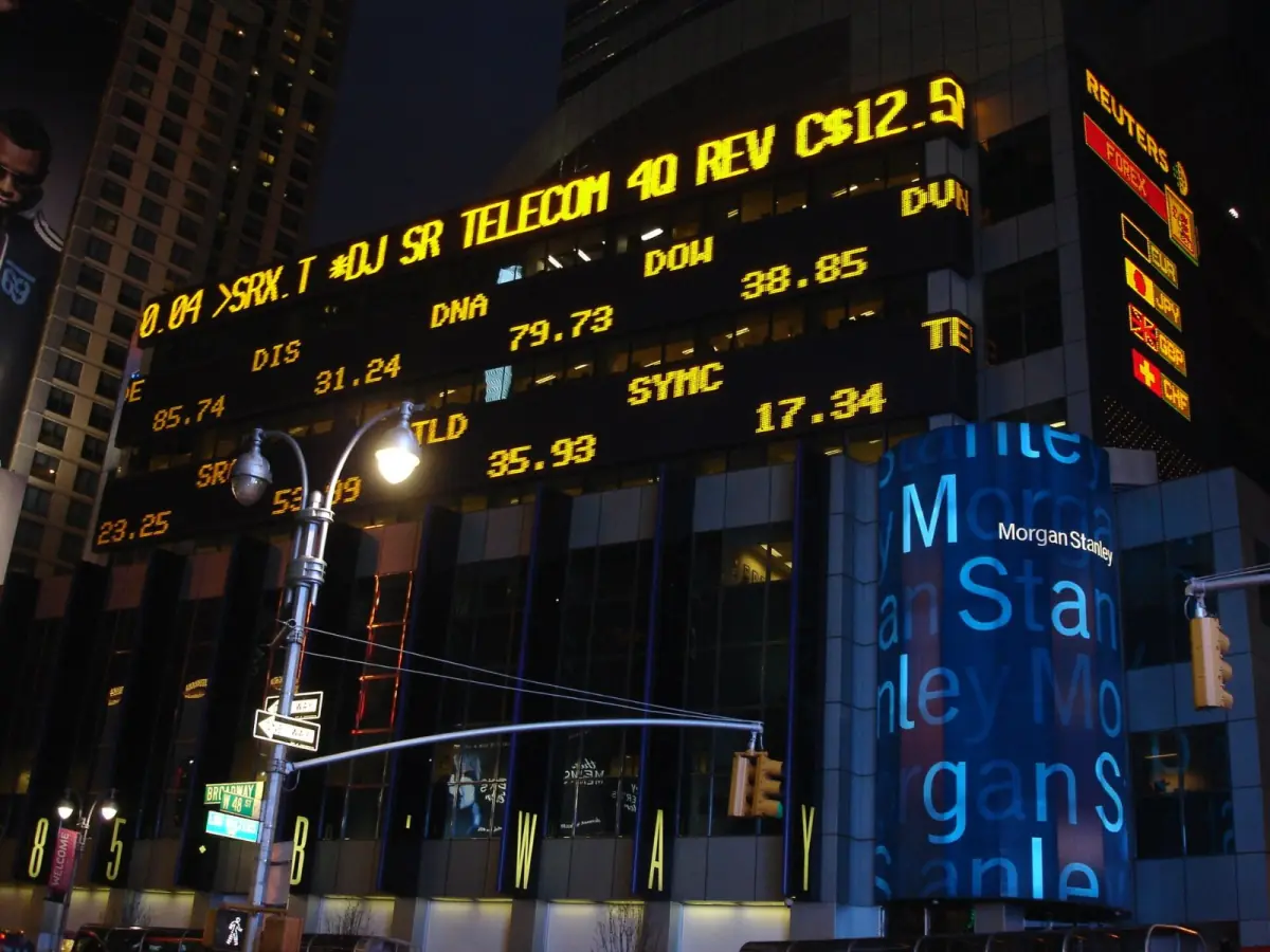 Morgan Stanley building in Times Square at night with stock ticker displays